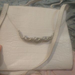 A white crocodile silver silver front latch bag